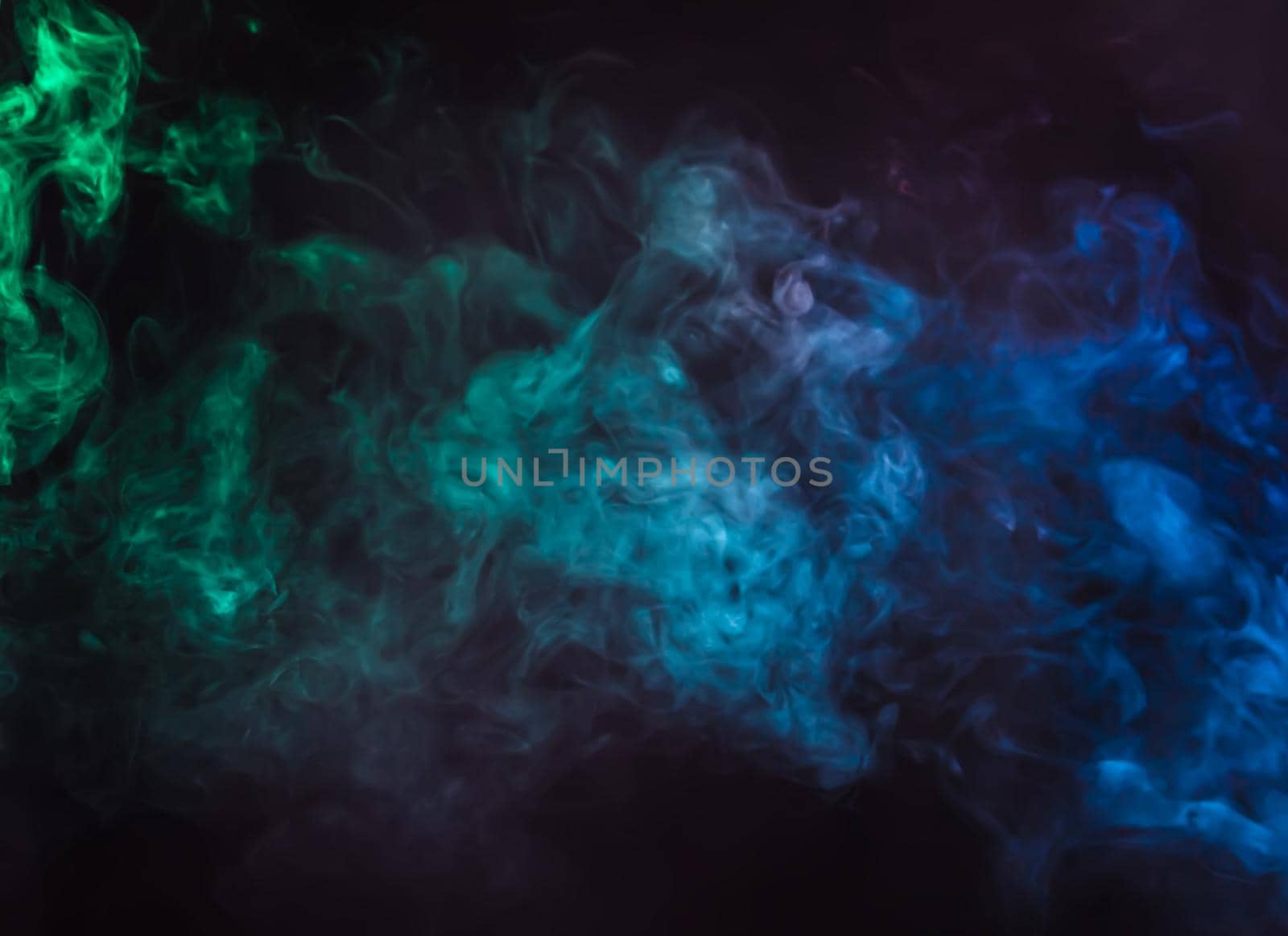 Defocused blurred abstract image of colorful smoke. Texture and abstract art