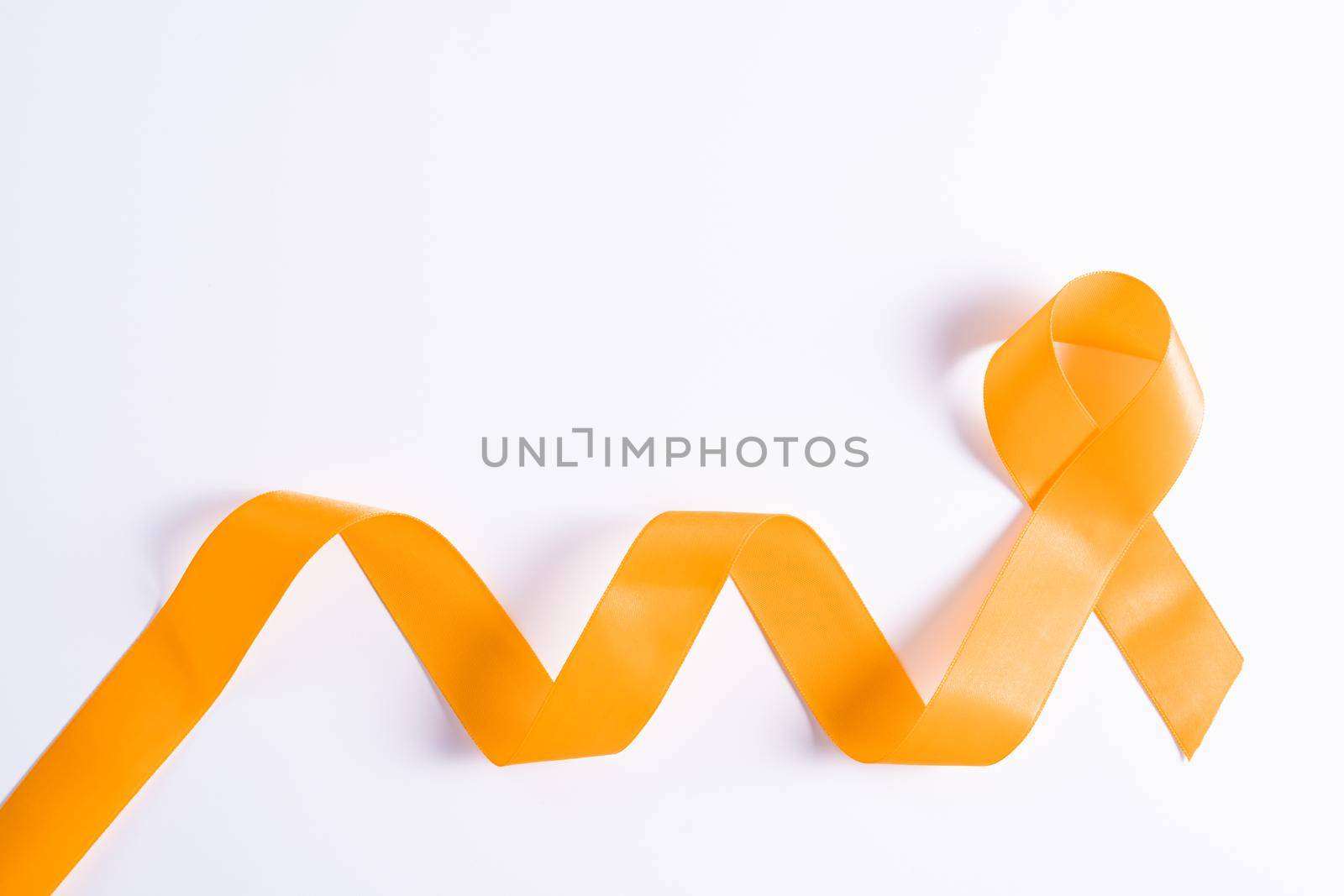 World kidney day, orange ribbon awareness of kidney disease isolated white background.