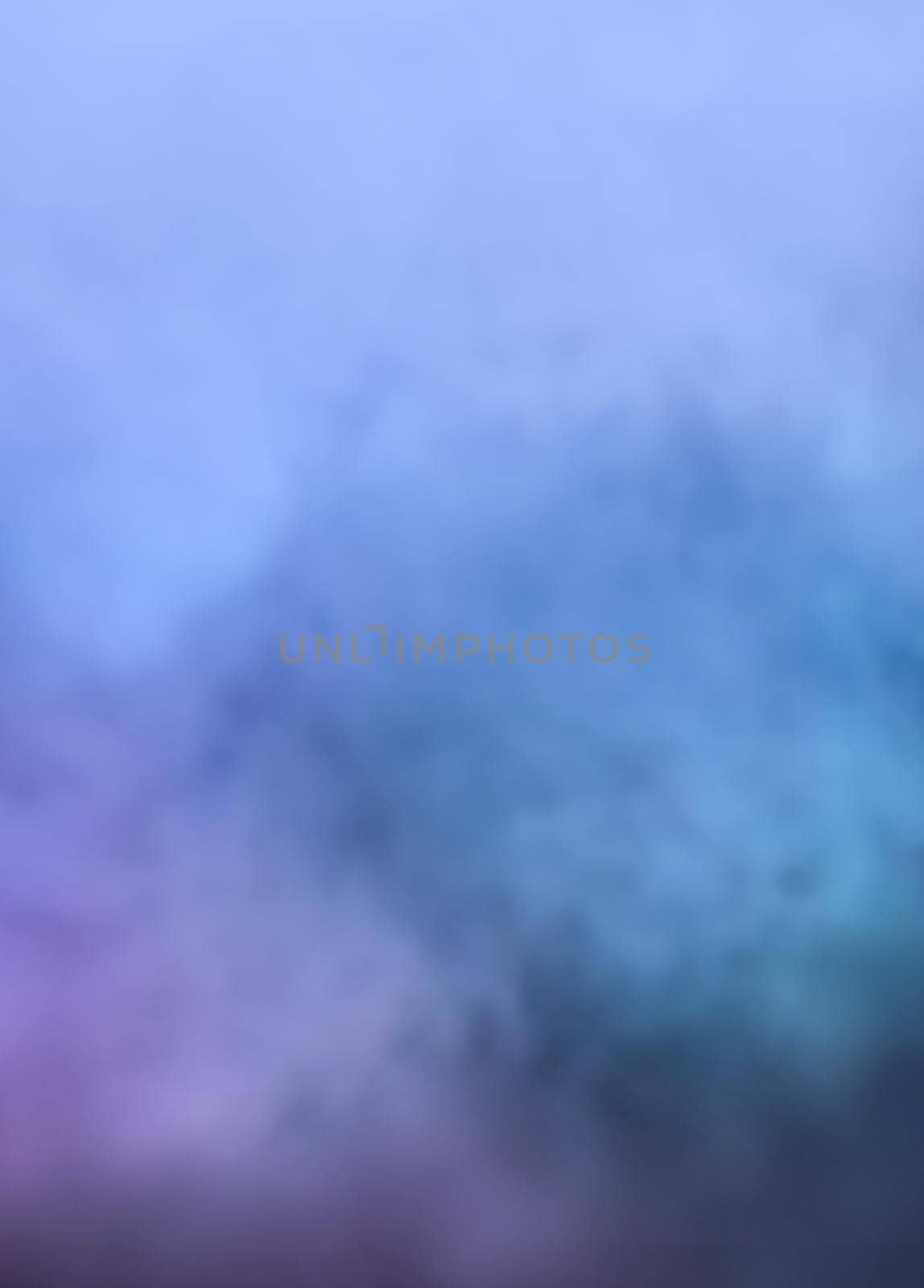 Defocused blurred image of colorful smoke on dark background. Texture and abstract art
