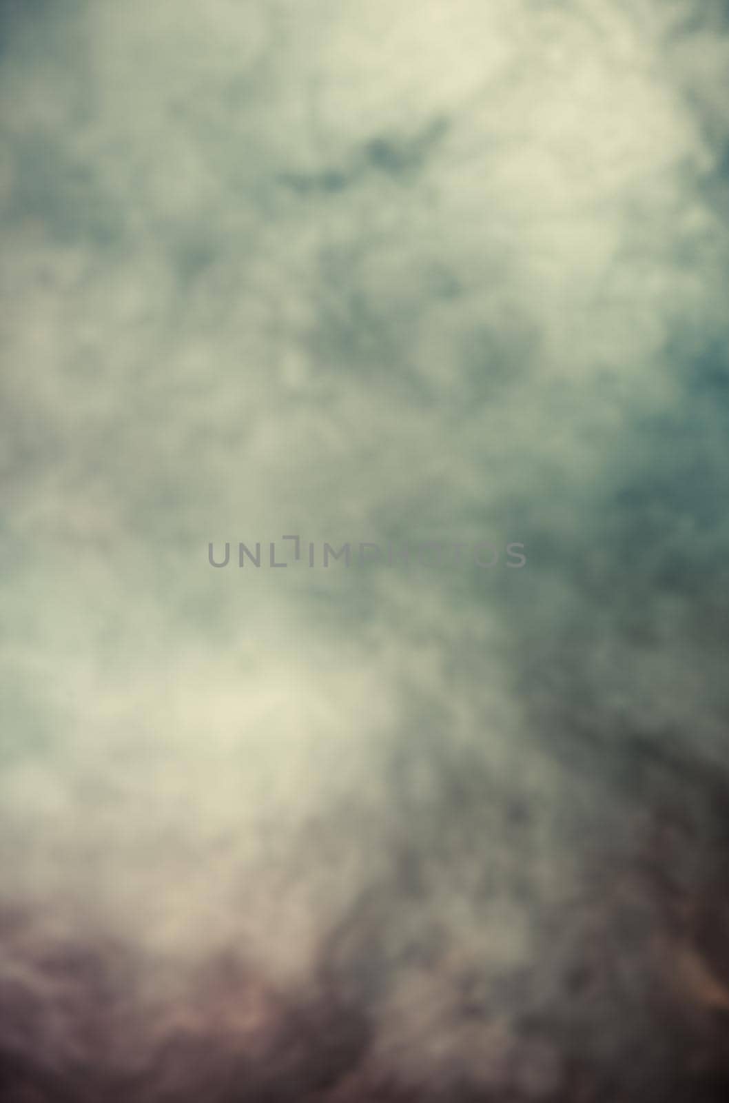 Soft focus abstract image of colorful smoke on dark background. Texture and abstract art
