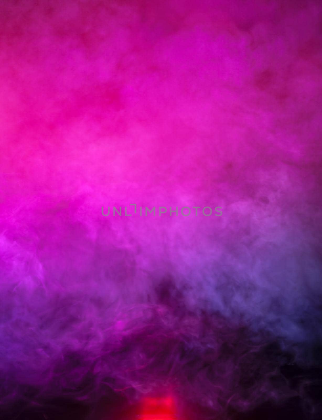 Soft focus abstract image of colorful smoke on dark background. Texture and abstract art