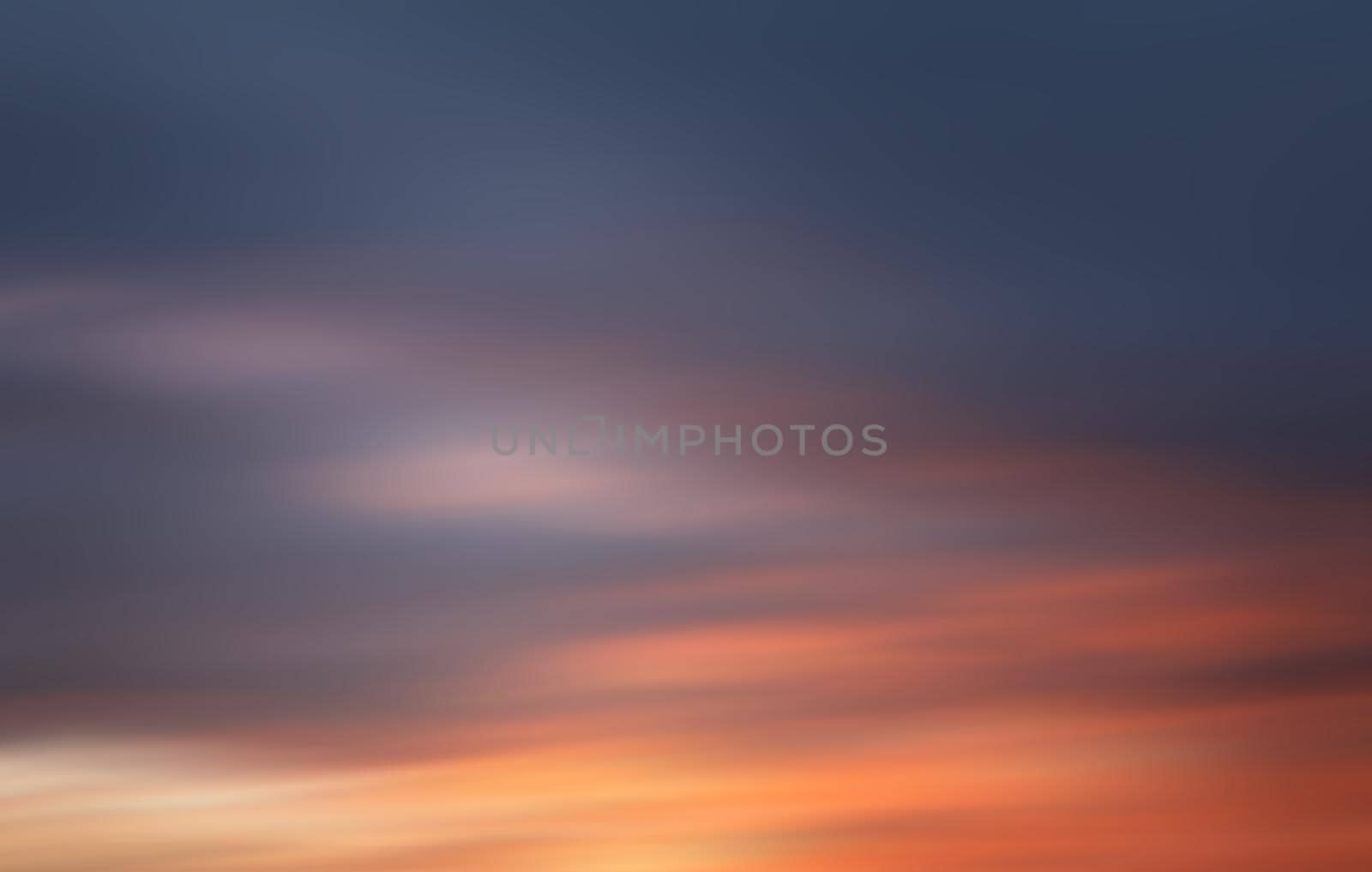 Blurred nature background. Smooth relax landscape. Abstract sunset sky with motion blurred clouds