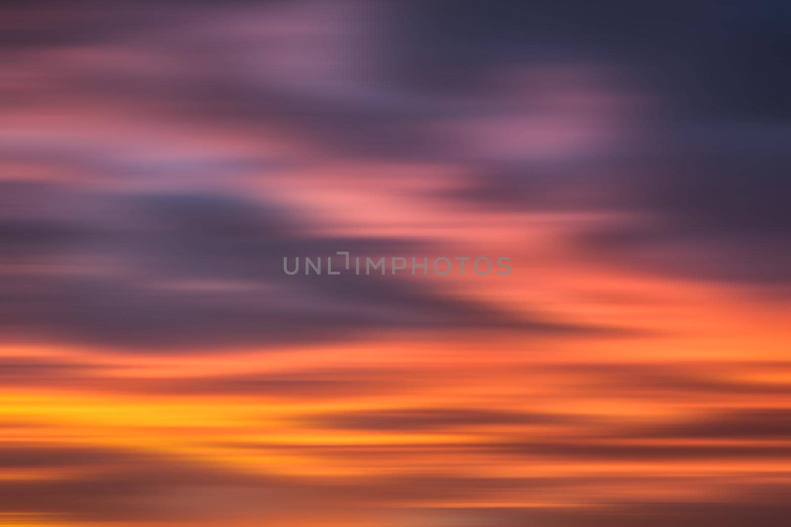 Blurred nature background. Smooth relax landscape. Abstract sunset sky with motion blurred clouds