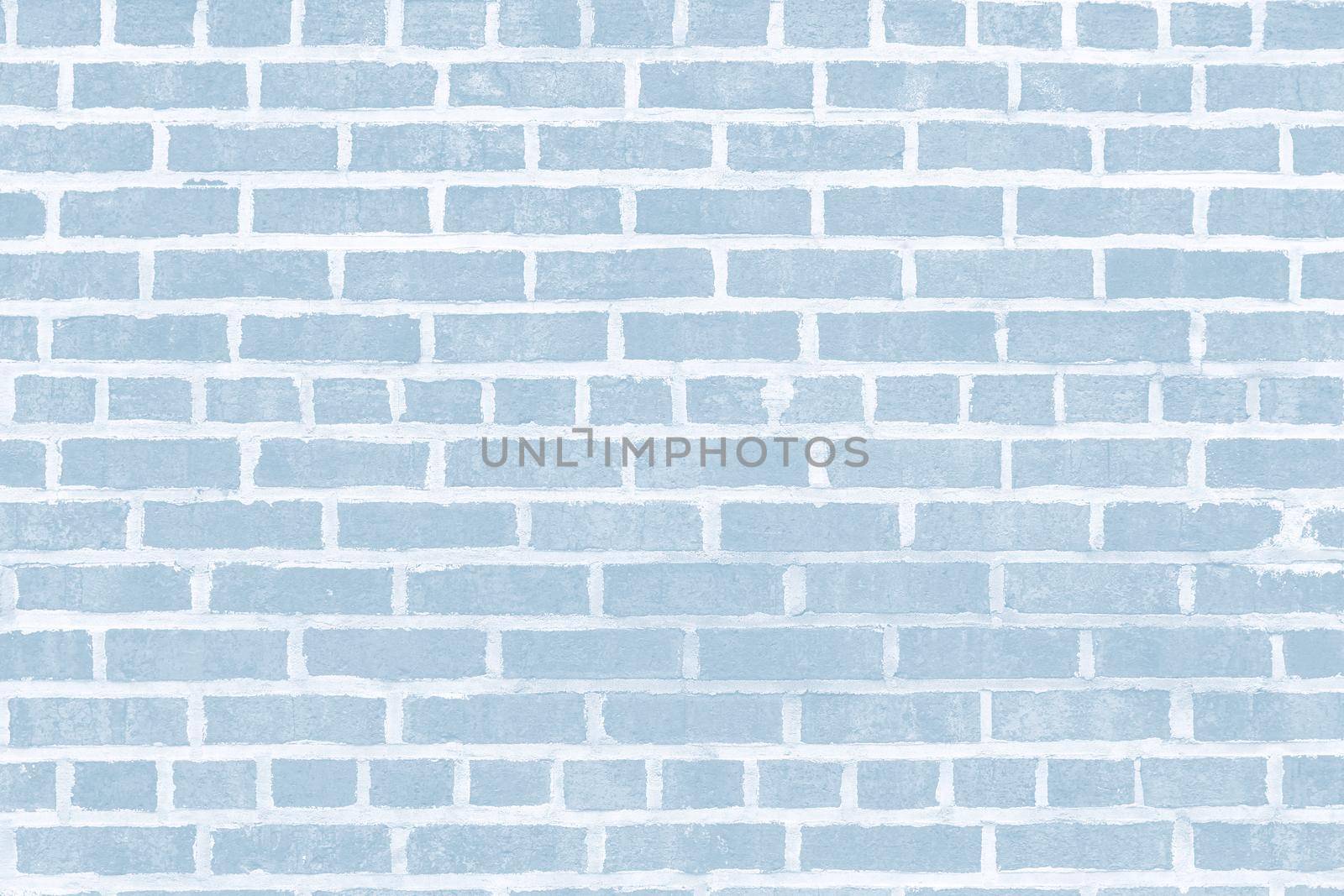 Old brick wall background. Texture of building facades  in light blue tonality