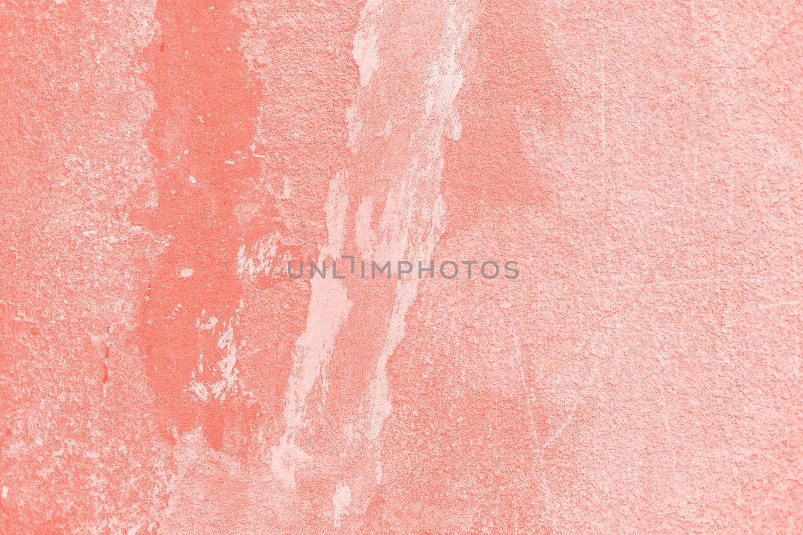 Background of old painted wall. Aged street wall background, texture. Image in trendy living coral color