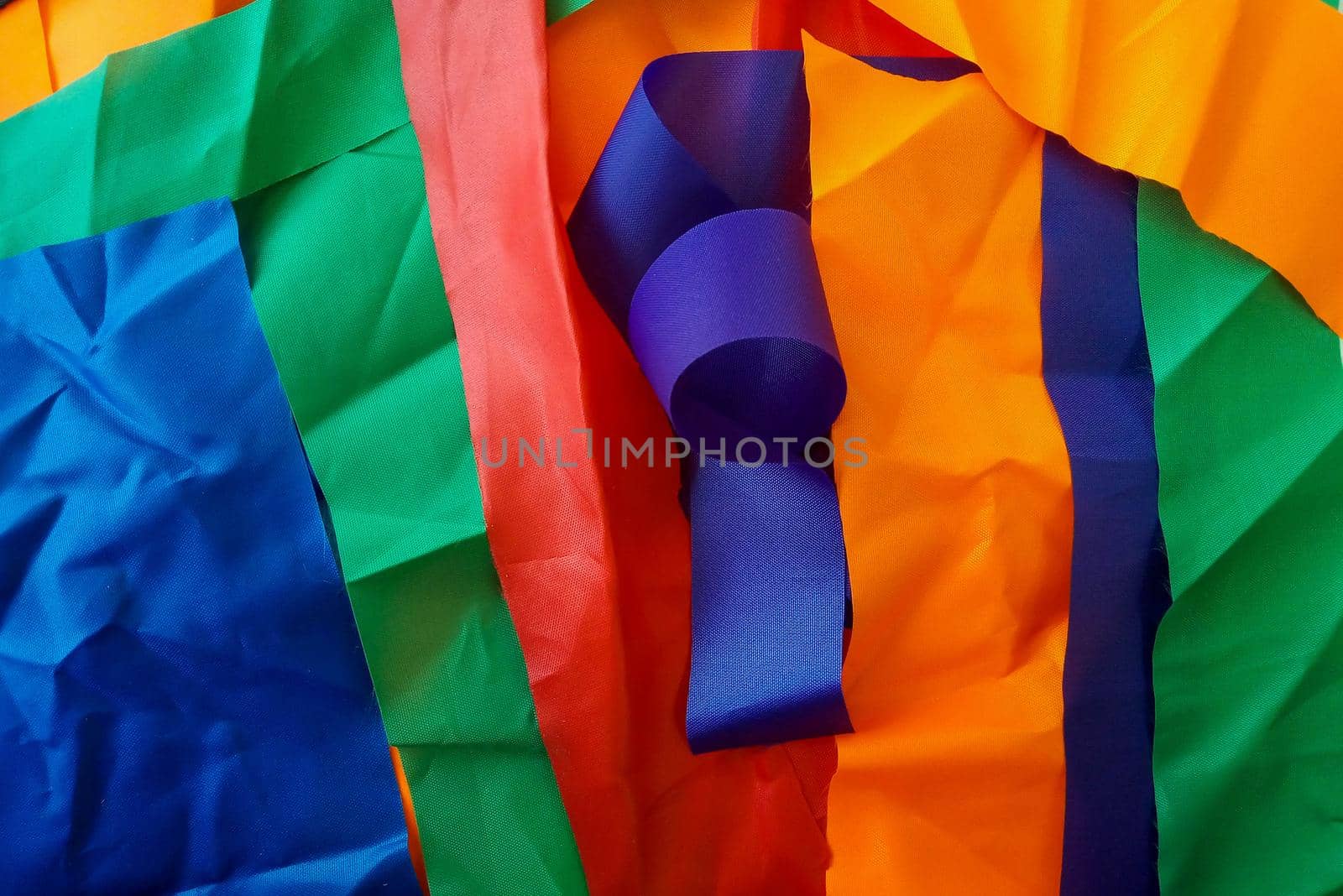 Colorful scraps of fabric in disarray on the table.