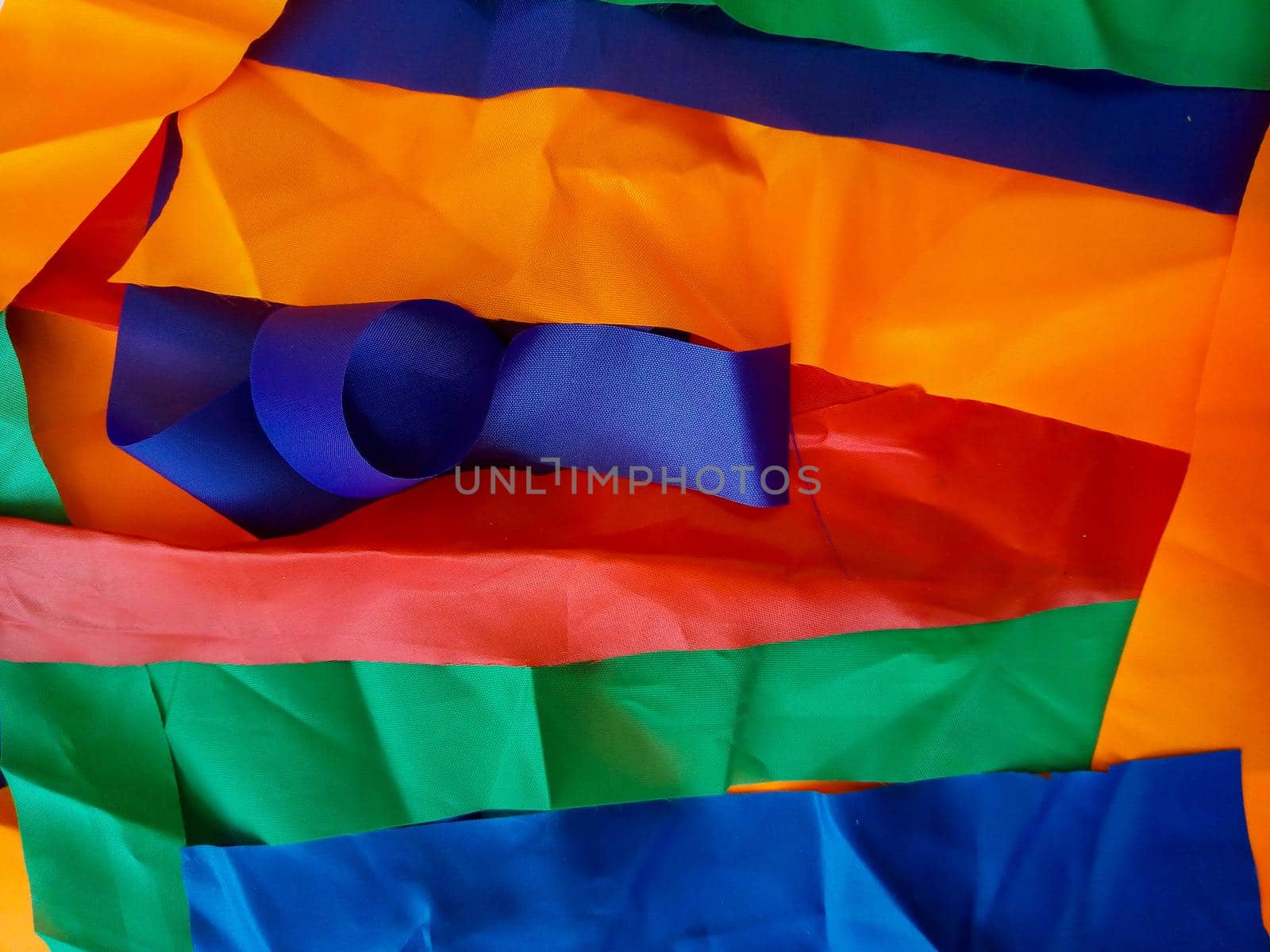 Colorful scraps of fabric in disarray on the table.