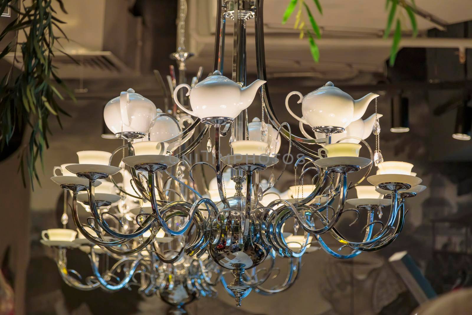 Luxurious large chandelier, lamps in the form of porcelain teapots and cups and saucers. Iron base.