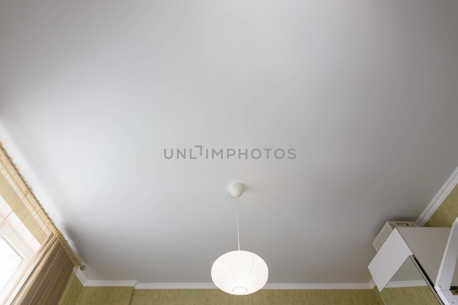 Stretch white matte ceiling close-up in a bedroom by Madhourse