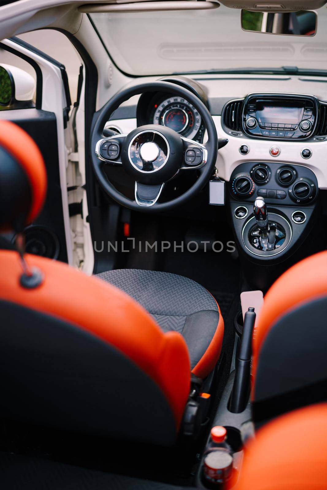 Photo The interior of the convertible car from the rear seat. Phot of the interior of a small convertible car