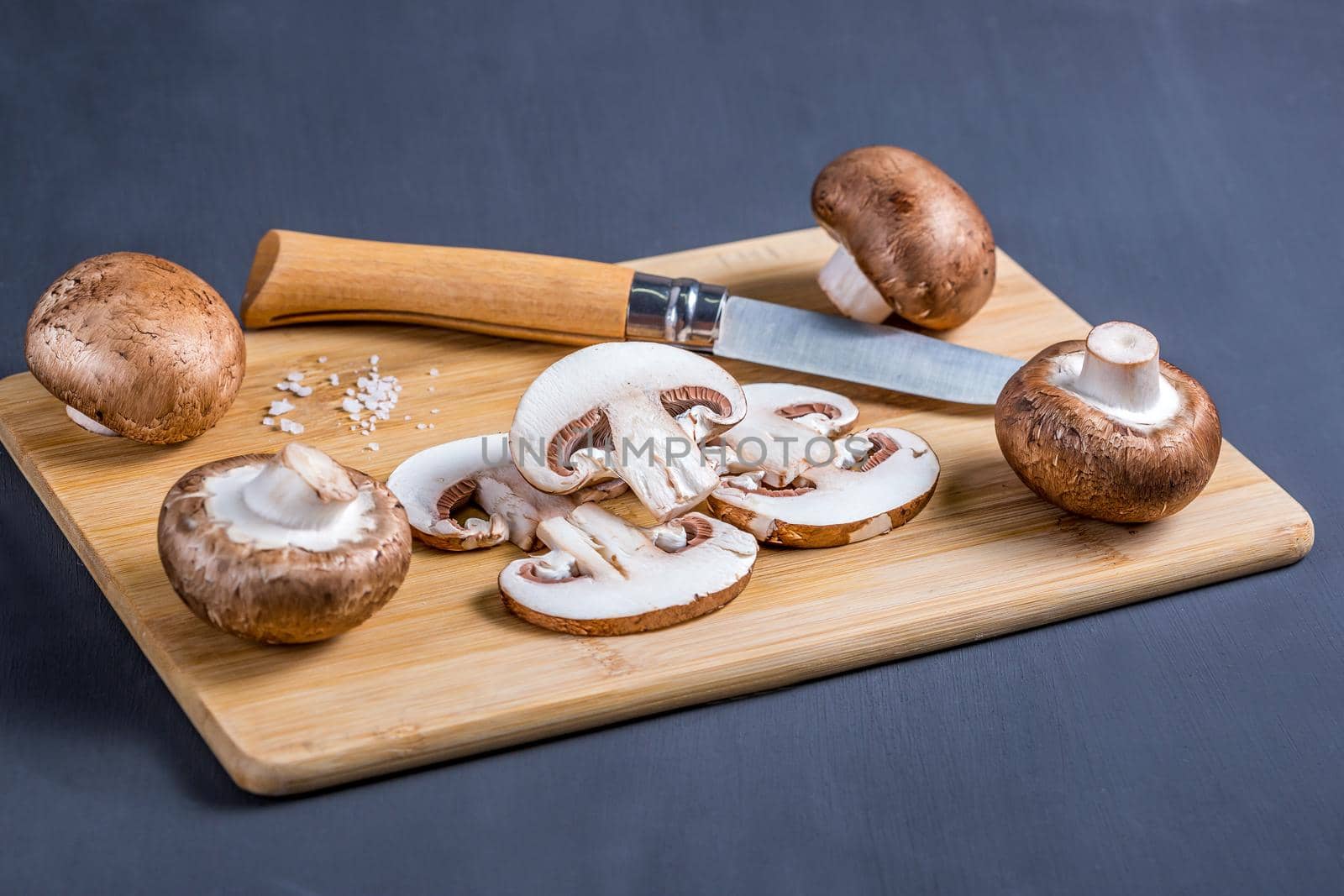 Royal champignons, Parisian champignons, mushrooms on bamboo chopping board. by galinasharapova
