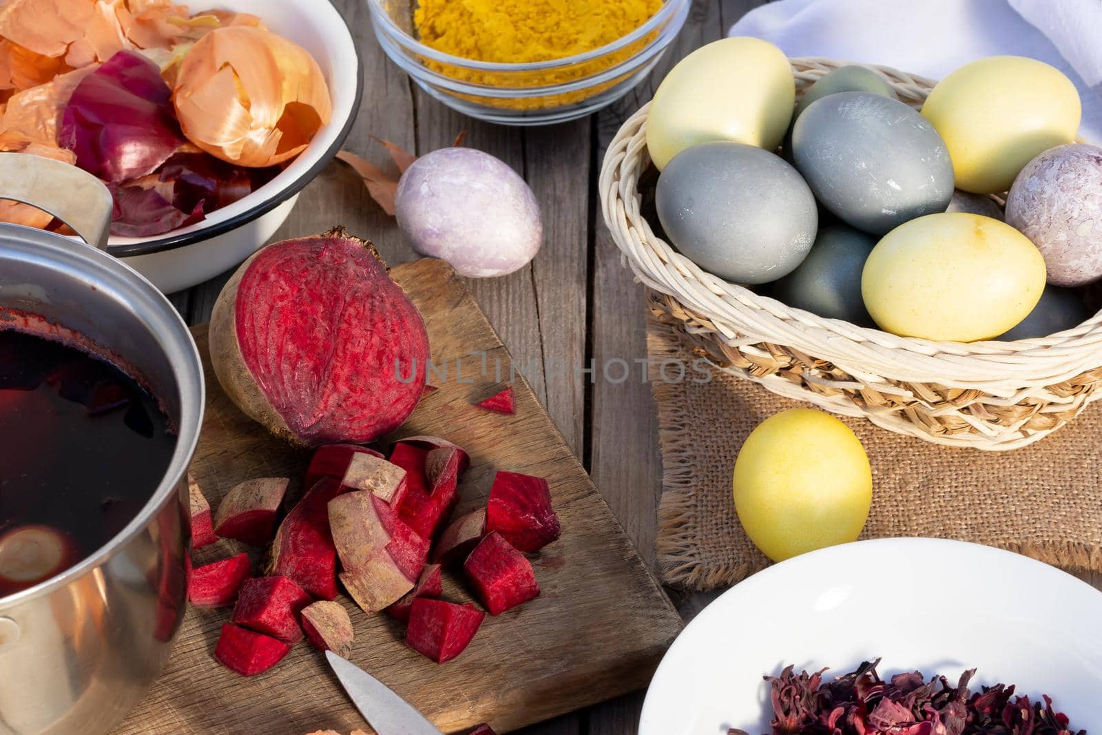 Process of coloring Easter eggs with various food natural dyes. Preparing for Easter