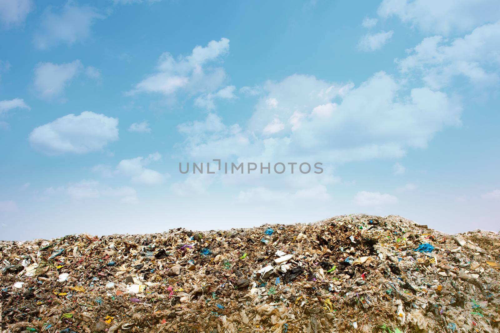 Pollution concept. Garbage pile in trash dump or landfill. by thanumporn