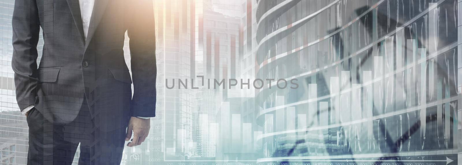 The double exposure image of the business man standing with bar graph and cityscape background.