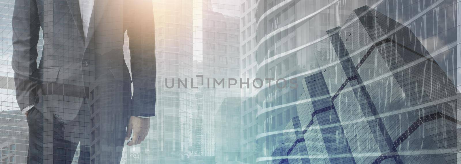 The double exposure image of the business man standing with cityscape image. The concept of modern life, business, city life and internet of things.