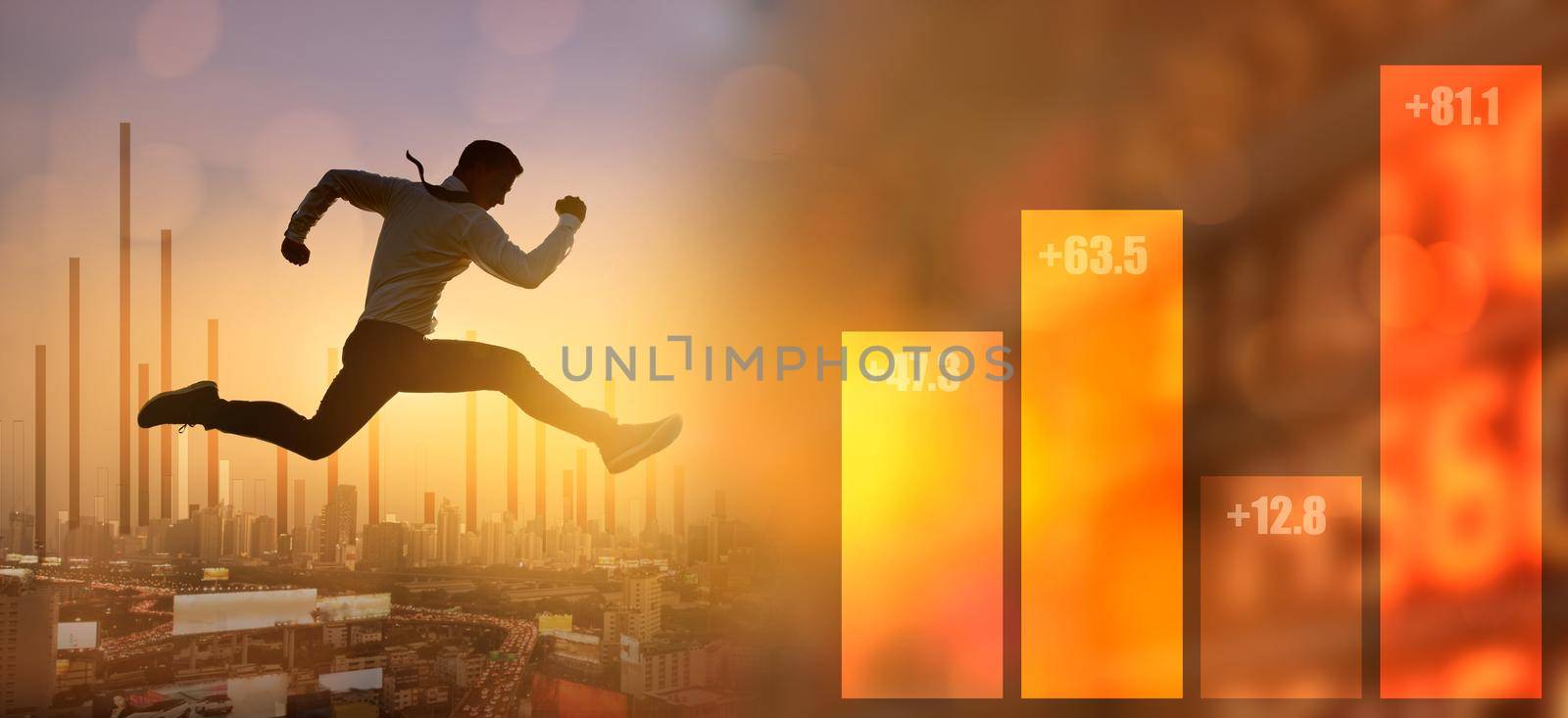 Businessman jumping on bar graph on modern city background. Business and financial success concept. by thanumporn
