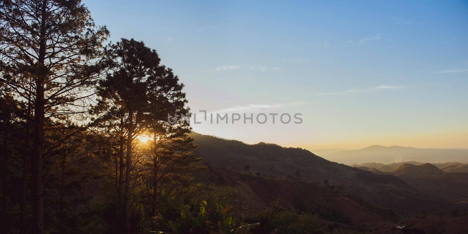 Amazing mountain landscape with sunrises on the sky, natural outdoor travel background. Beauty world.