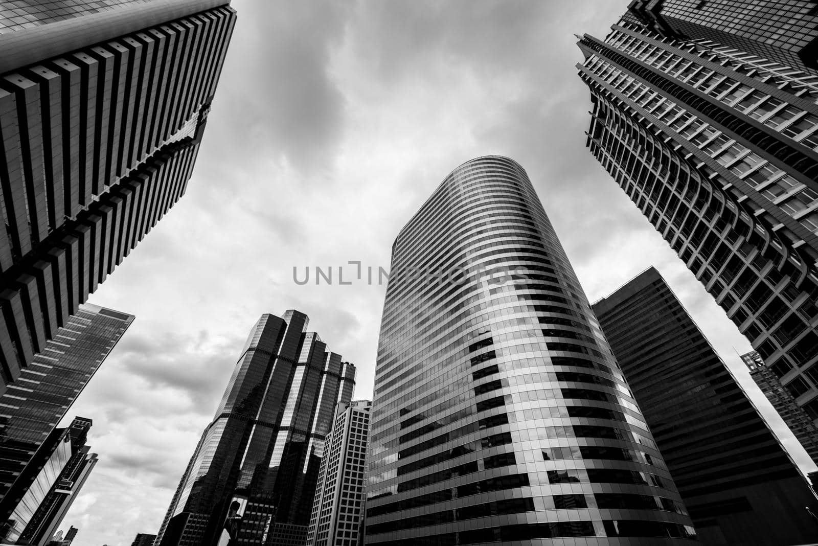 Bottom view of Modern business skyscrapers. Concepts of banking, financial, economics, future. Monochrome black and white color.