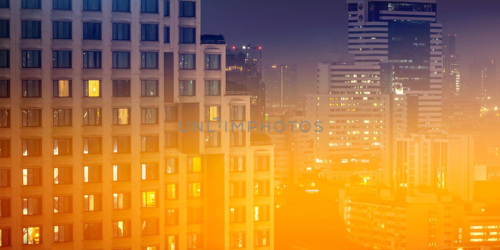 Night architecture. Skyscrapers with glass facade. Business, economy and finances concept. by thanumporn
