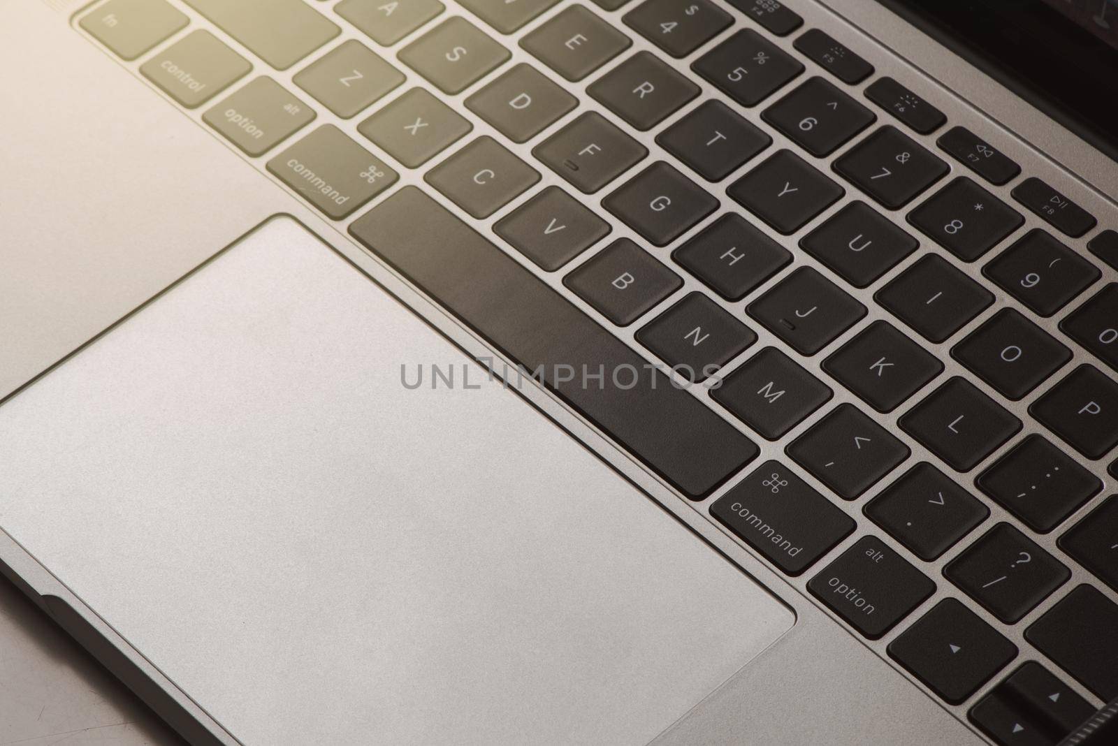 Close-up of laptop keyboard. by thanumporn