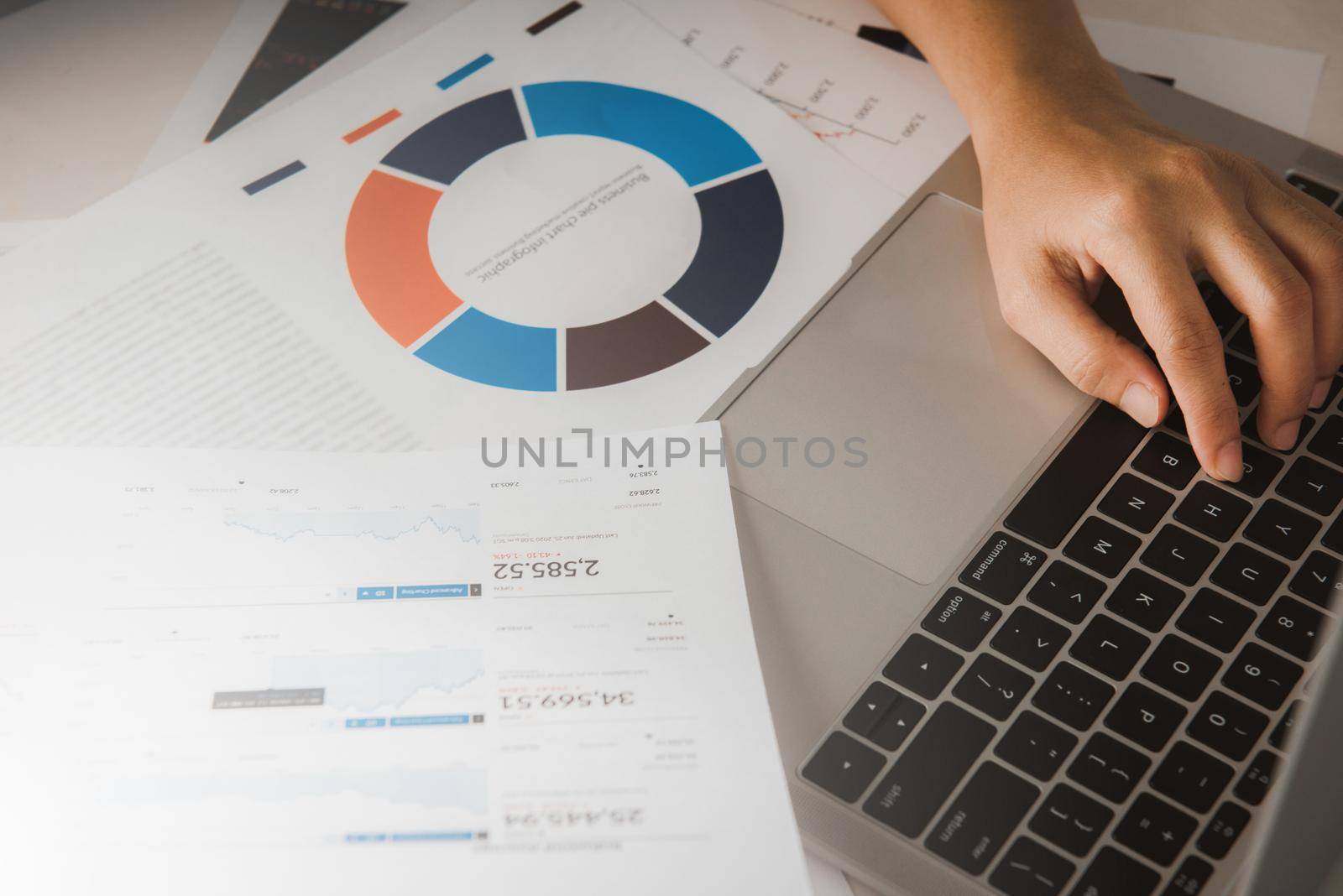 Businessman accountant or financial expert analyze business report graph and finance chart at corporate office. Concept of finance economy, banking business and stock market research.