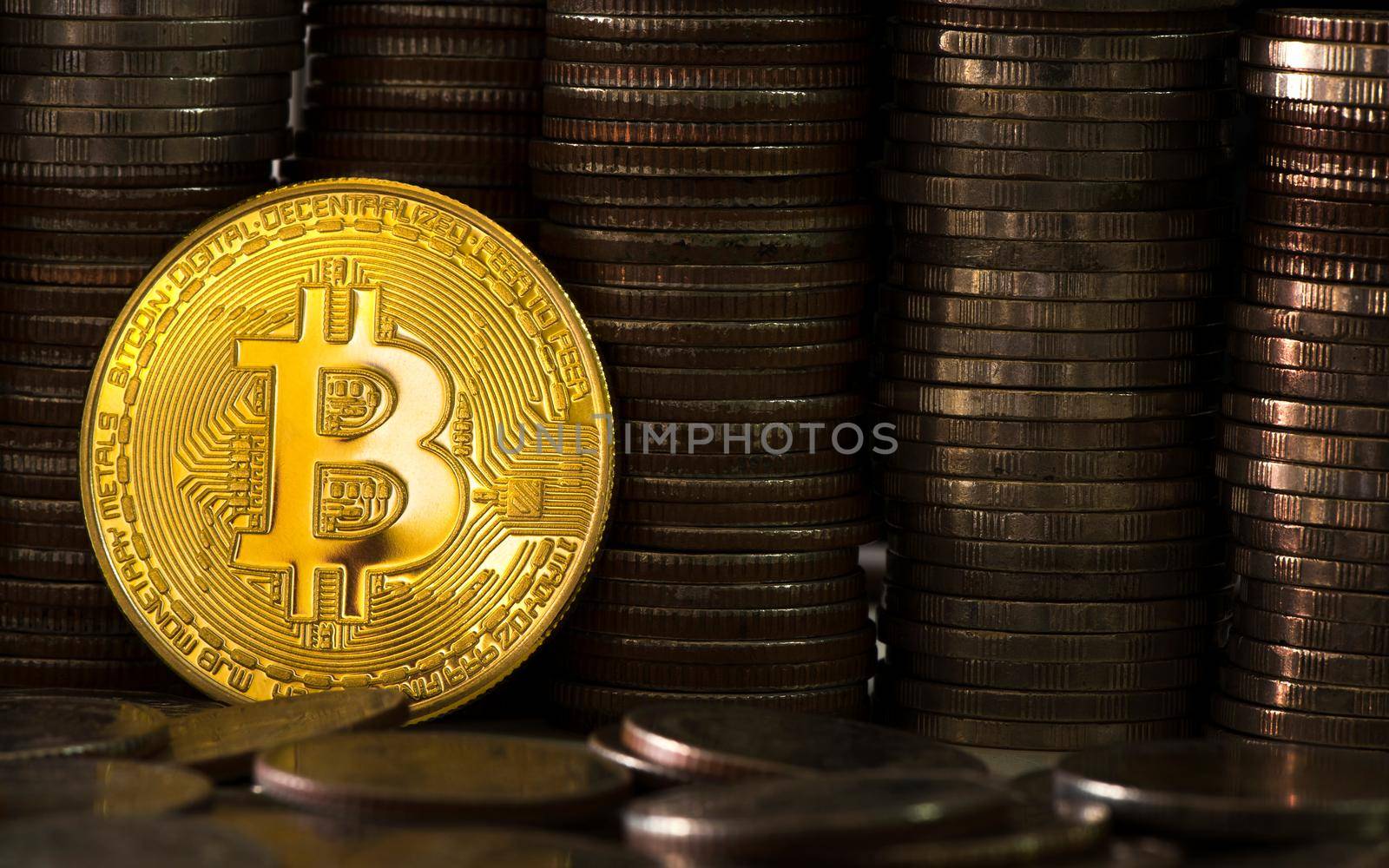 Close-up bitcoin on the background of coins of baht. Money and Financial business concept. by thanumporn