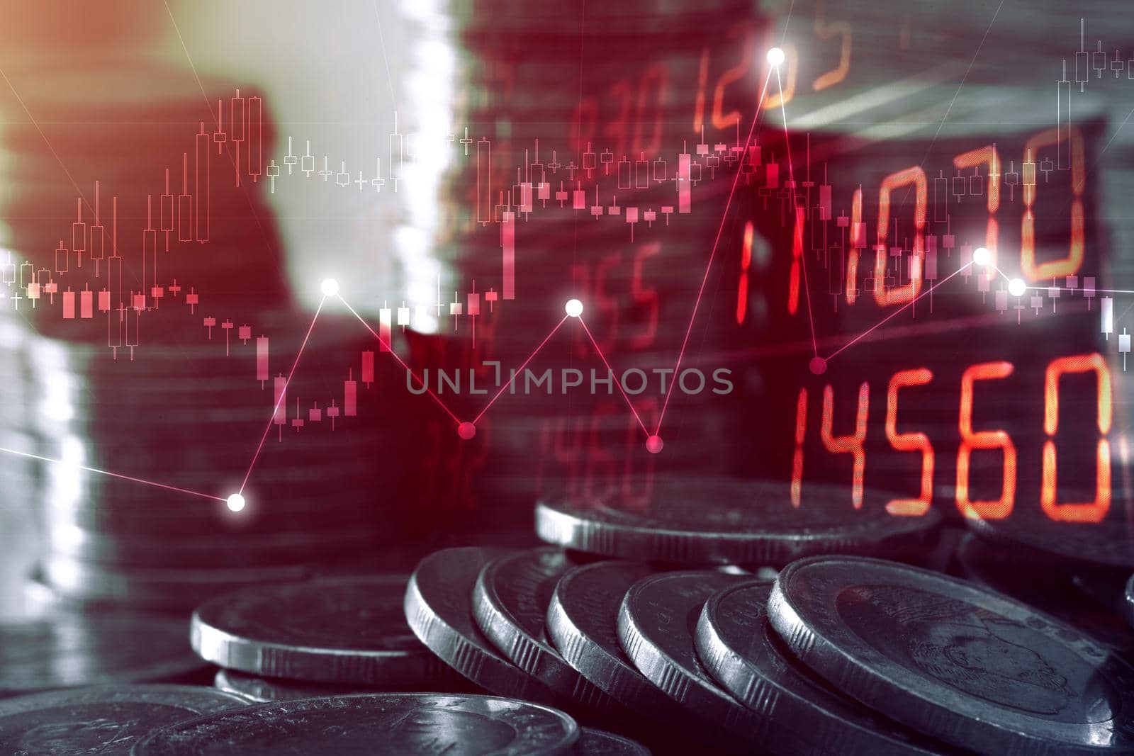 Double exposure of graph and rows of coins for finance and business concept. by thanumporn