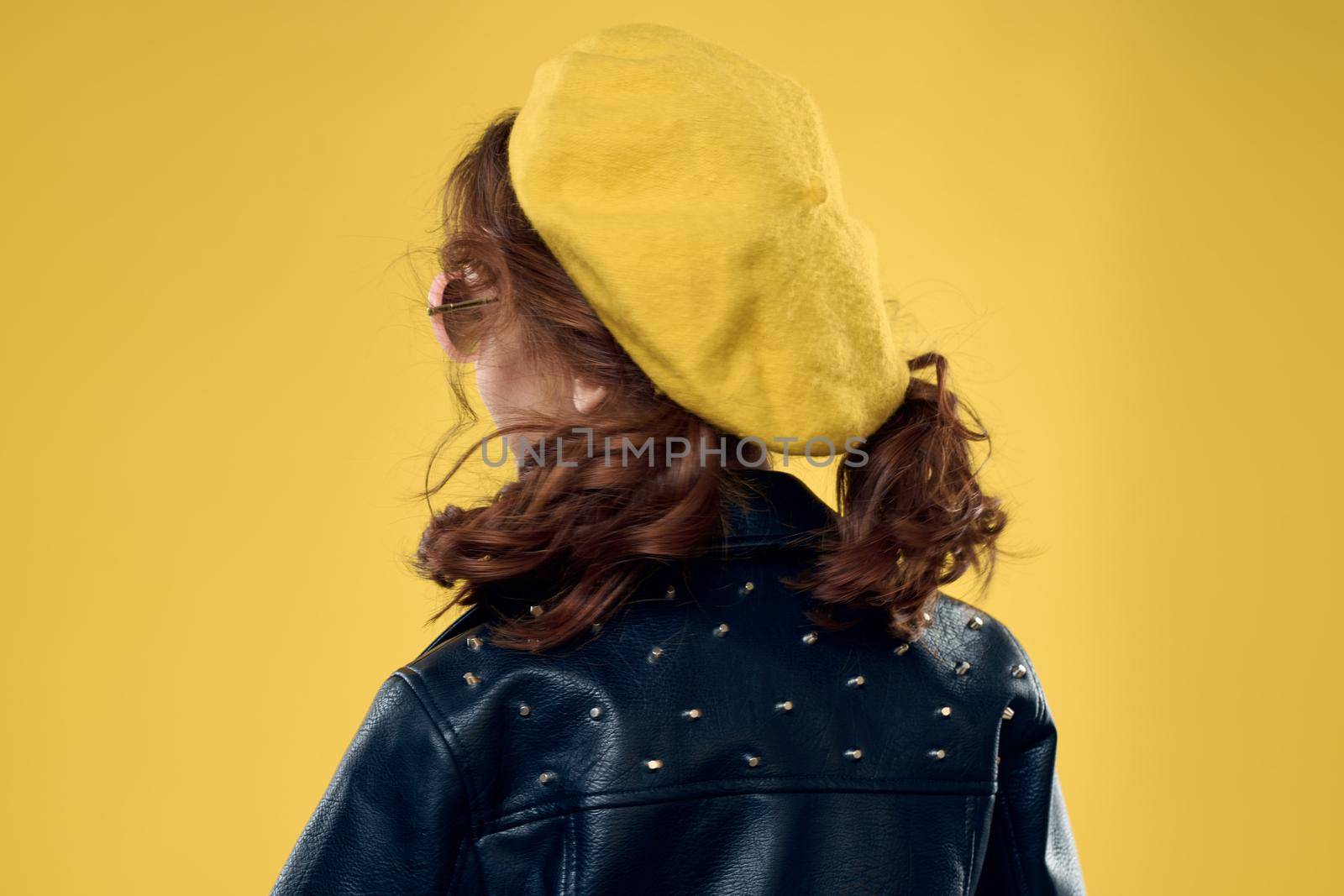 Girl in a yellow hat dark glasses fashionable clothes studio lifestyle childhood by SHOTPRIME