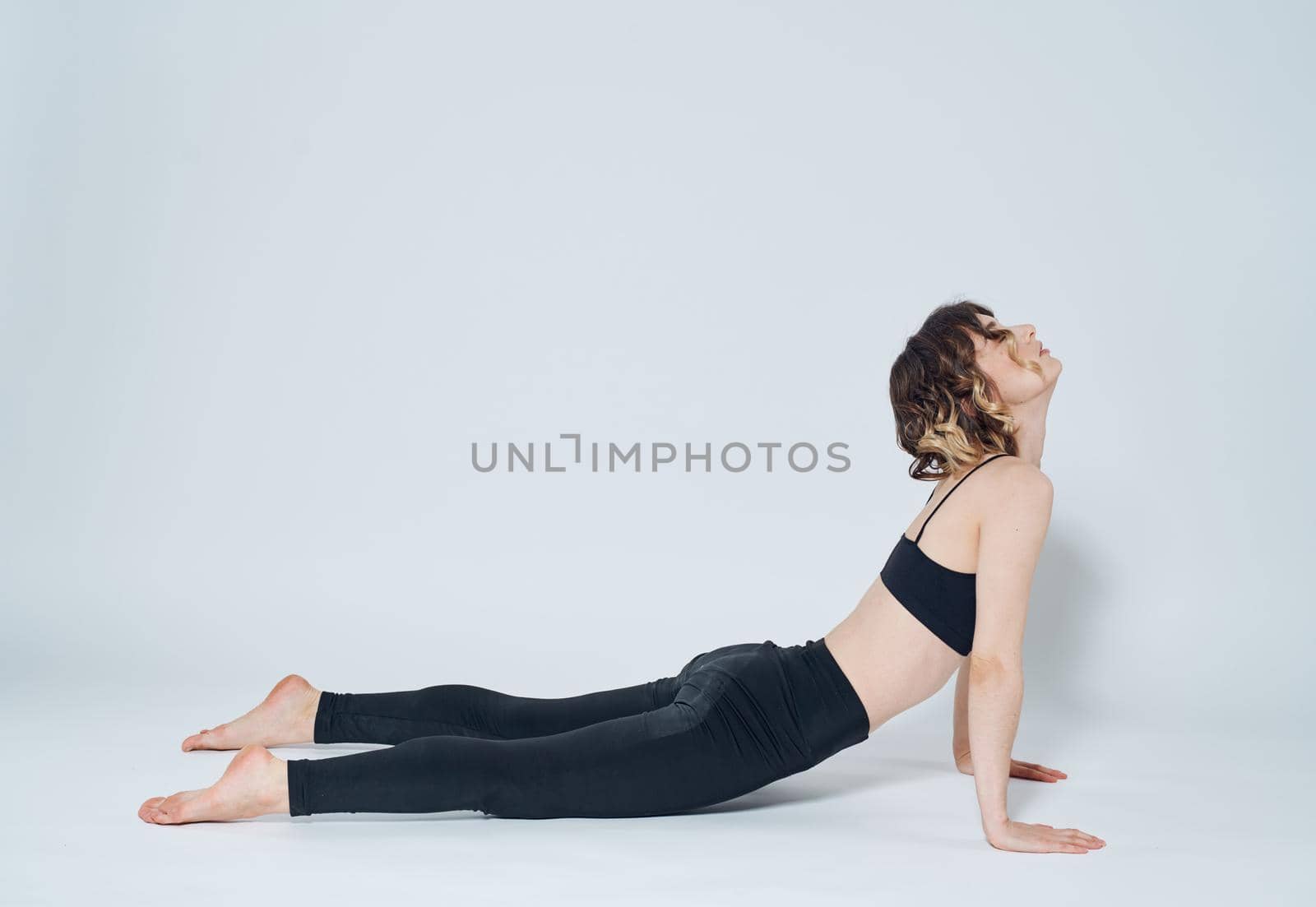 Women doing push-ups In a light room, sports meditation yoga asanas. High quality photo