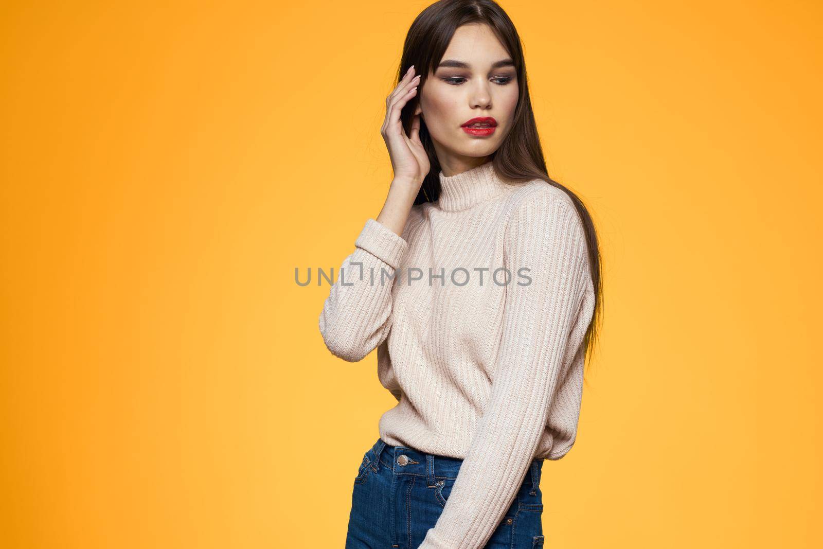 Cute brunette red lips fashionable clothes studio yellow background by SHOTPRIME