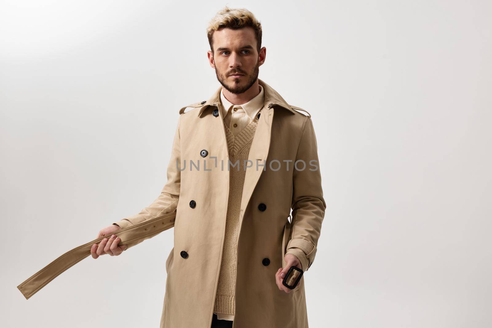 fashion man in beige blazer autumn style shirt. High quality photo