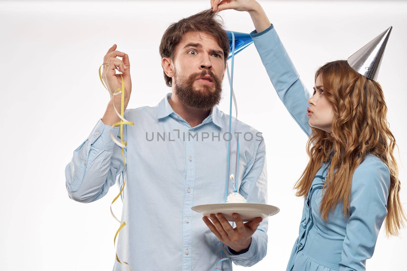 Cheerful man and woman with cake in a plate corporate party by SHOTPRIME