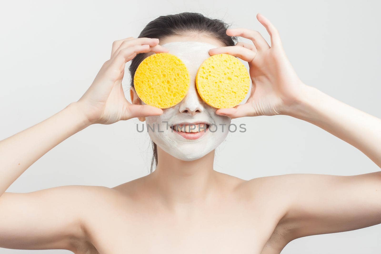 brunette wipes face mask with sponges cropped view. High quality photo