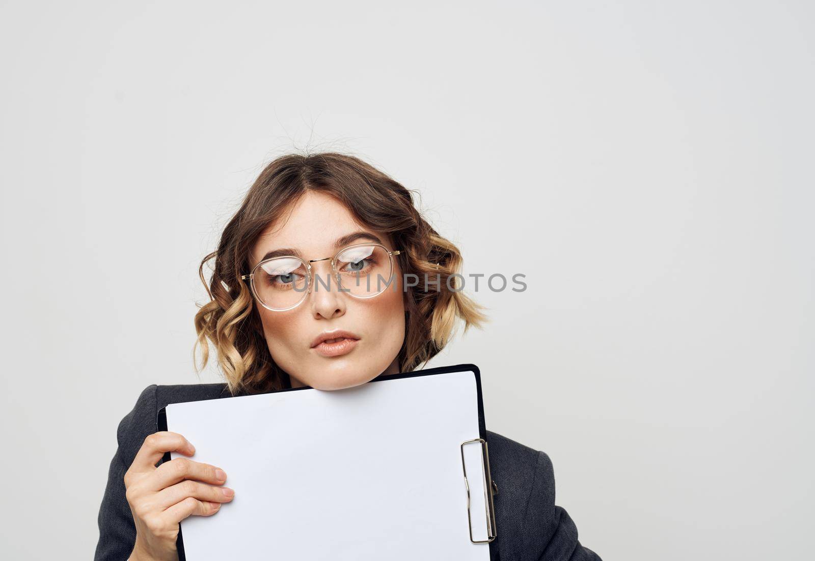 energetic woman with documents in folder classic suit light background mockup. High quality photo