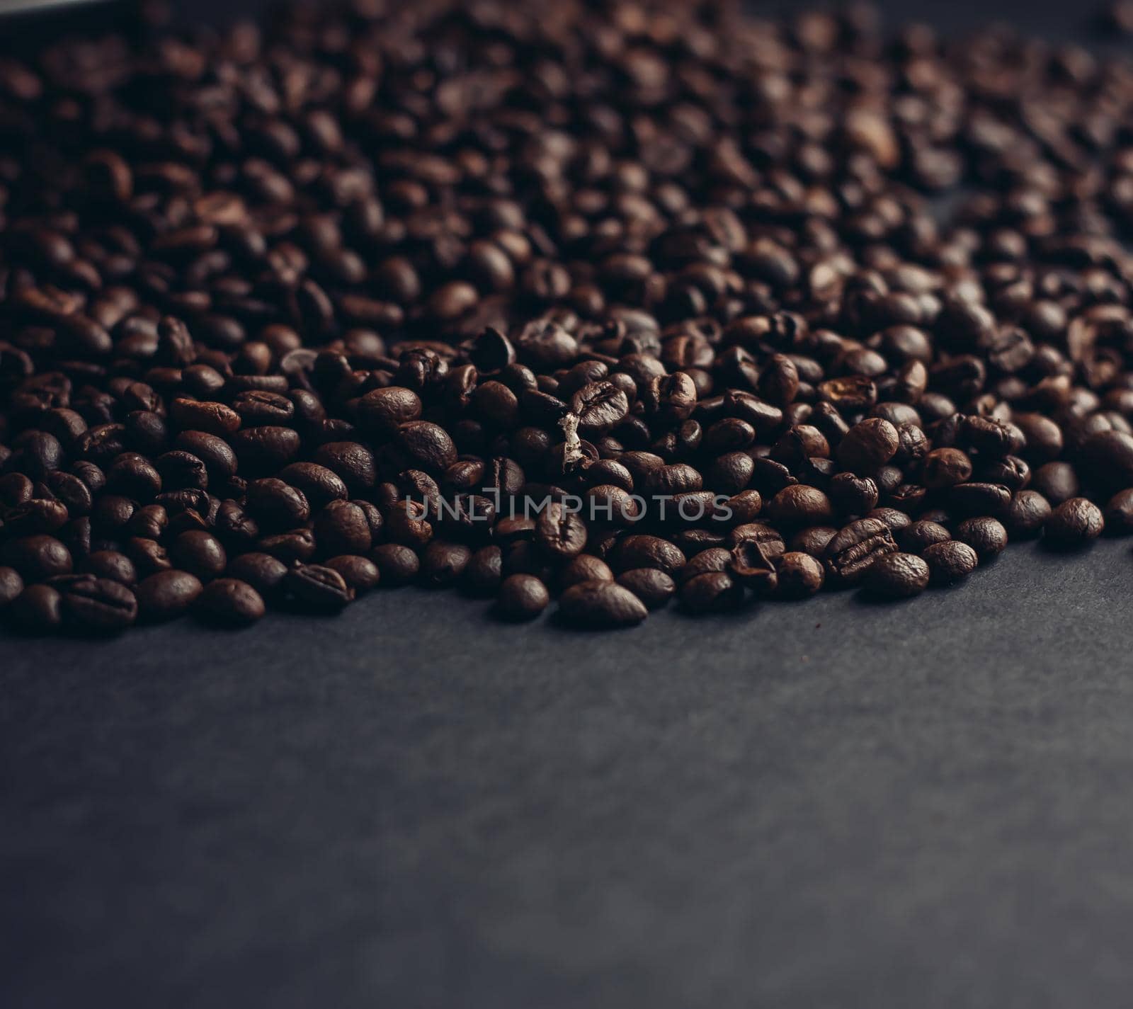 aromatic coffee beans on a dark background closeup close-up. High quality photo