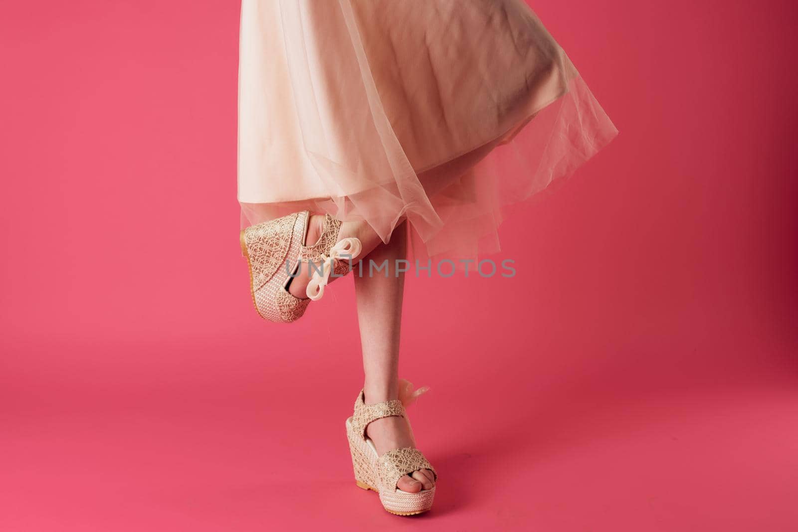 female feet fashion shoes elegant style cropped view pink background. High quality photo