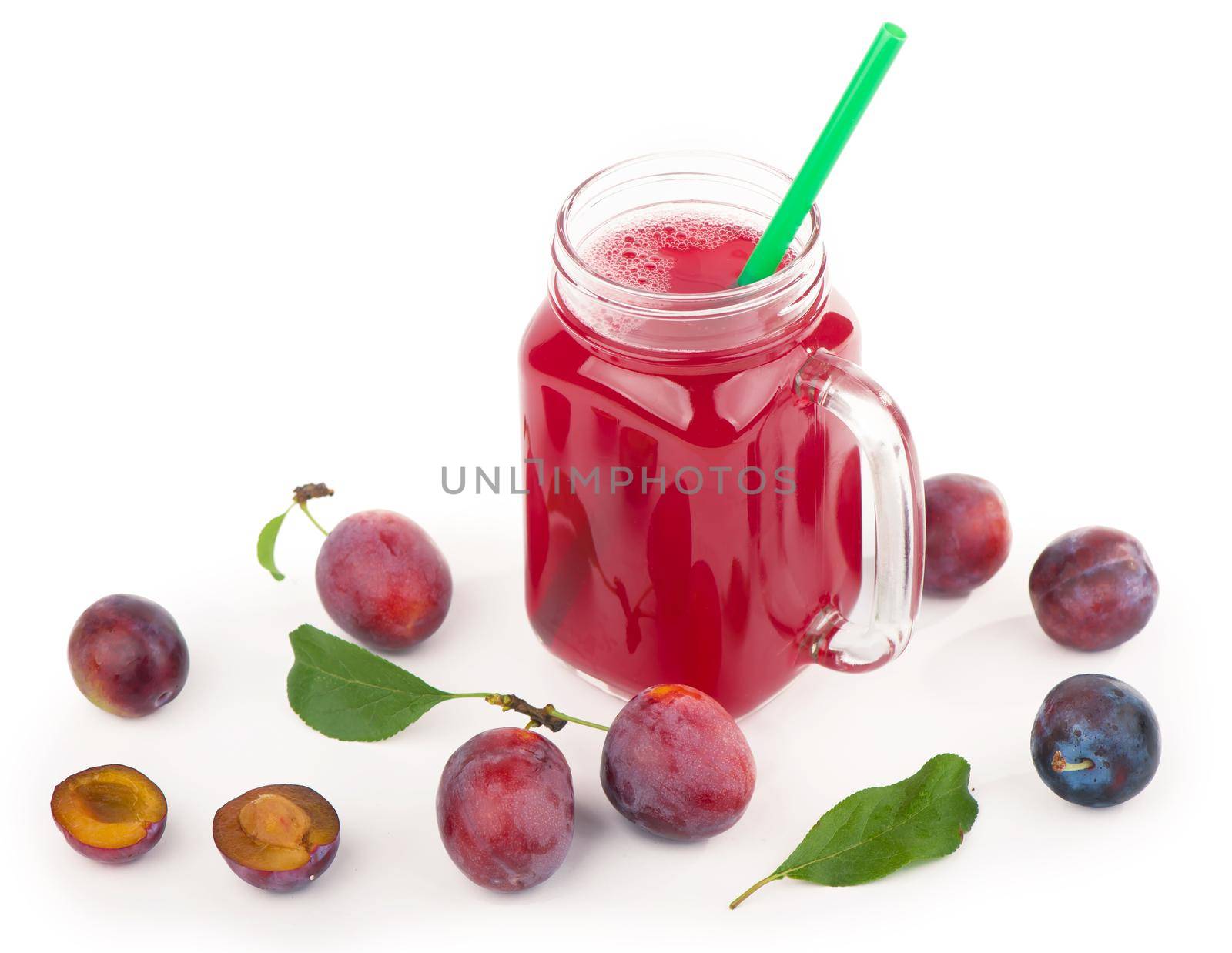 plum juice in a glass with fresh plum fruit isolated on white background.