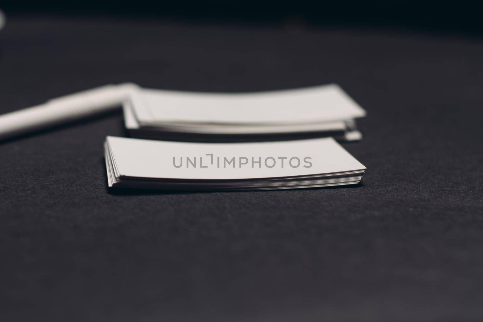 business cards on dark table and pen office mockup. High quality photo