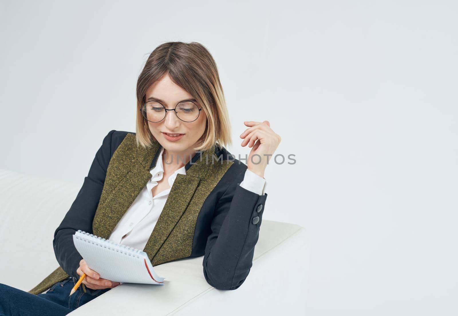 Woman In a bright room suit model business documents by SHOTPRIME