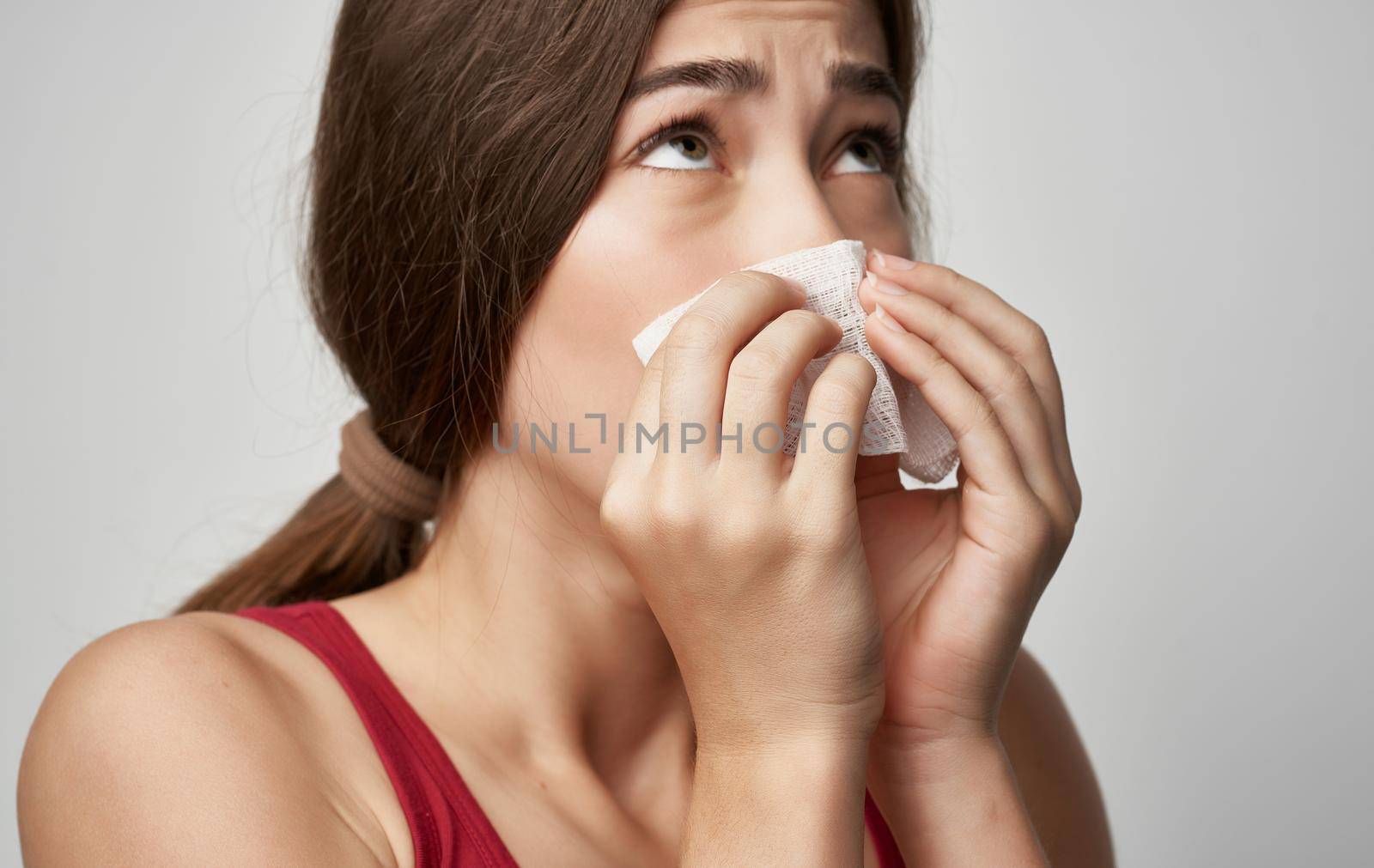sick woman in red t shirt health problems cold handkerchief. High quality photo