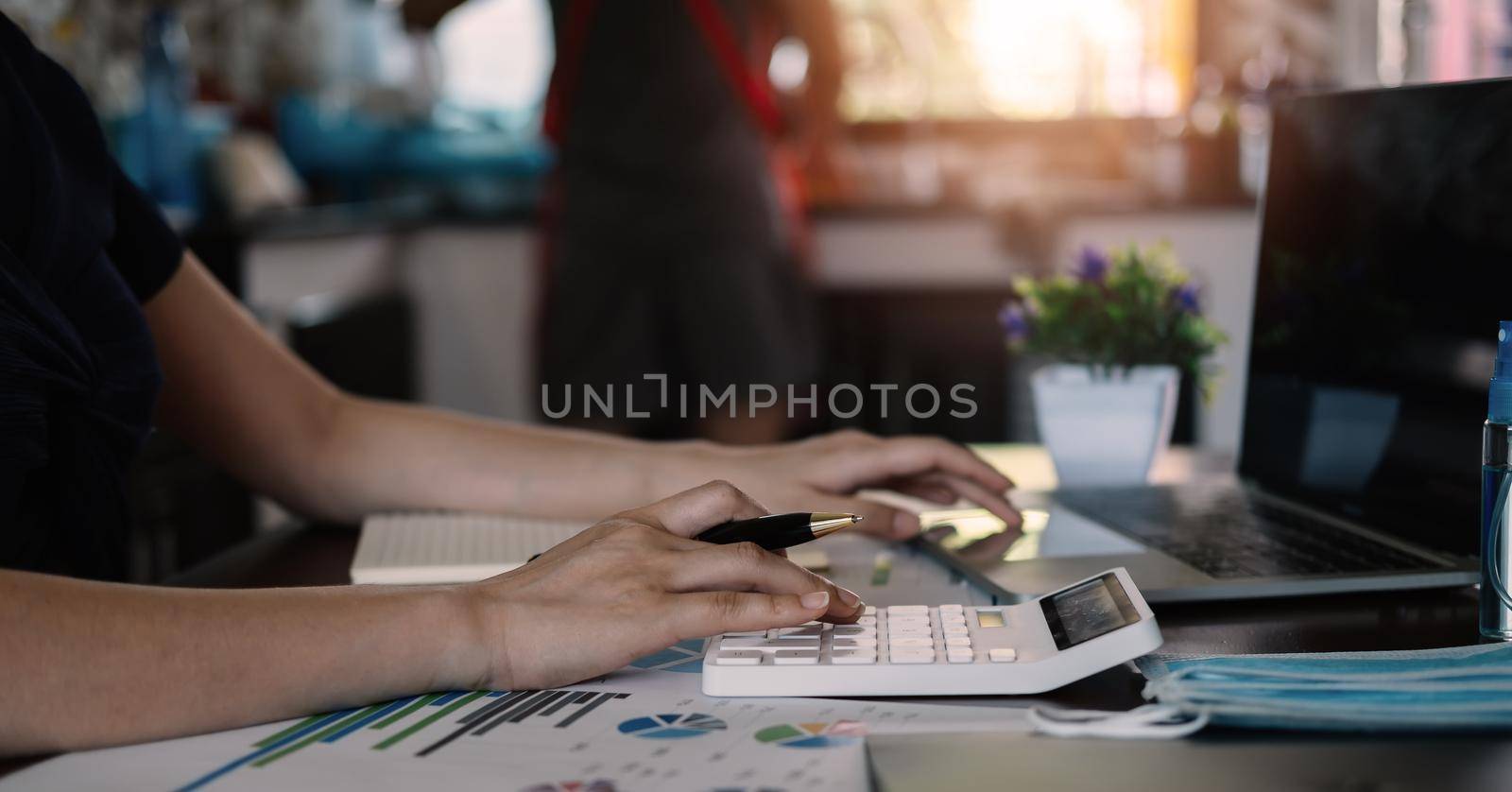 Close up view of bookkeeper or financial inspector hands making report, calculating or checking balance. Home finances, investment, economy, saving money or insurance at home