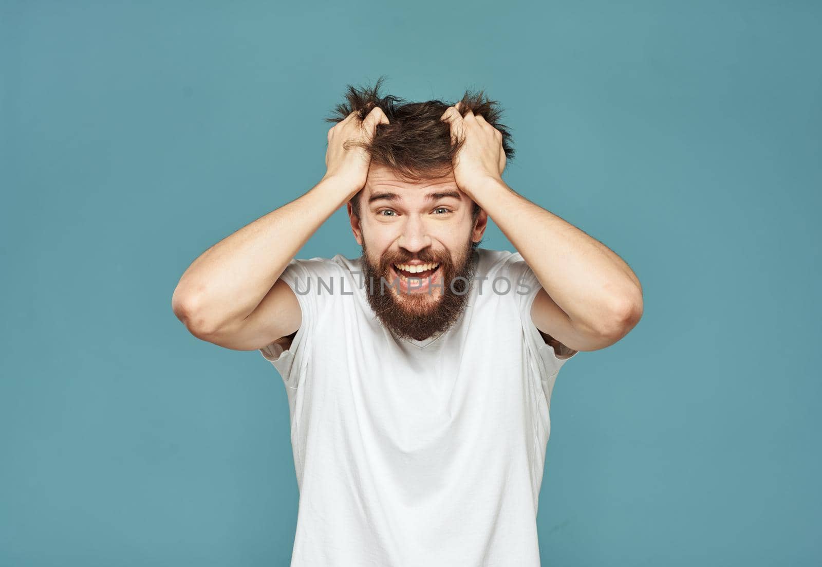 Emotional man gestures with his hands surprise shock model. High quality photo