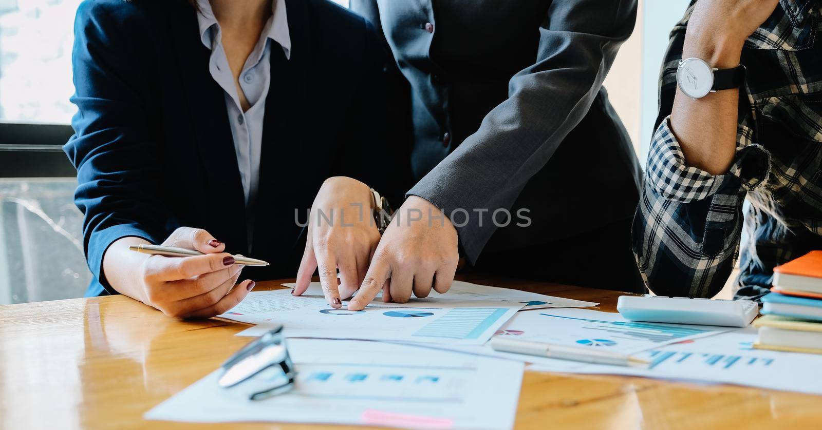 Group of business people busy discussing financial matter during meeting. Corporate Organization Meeting Concept