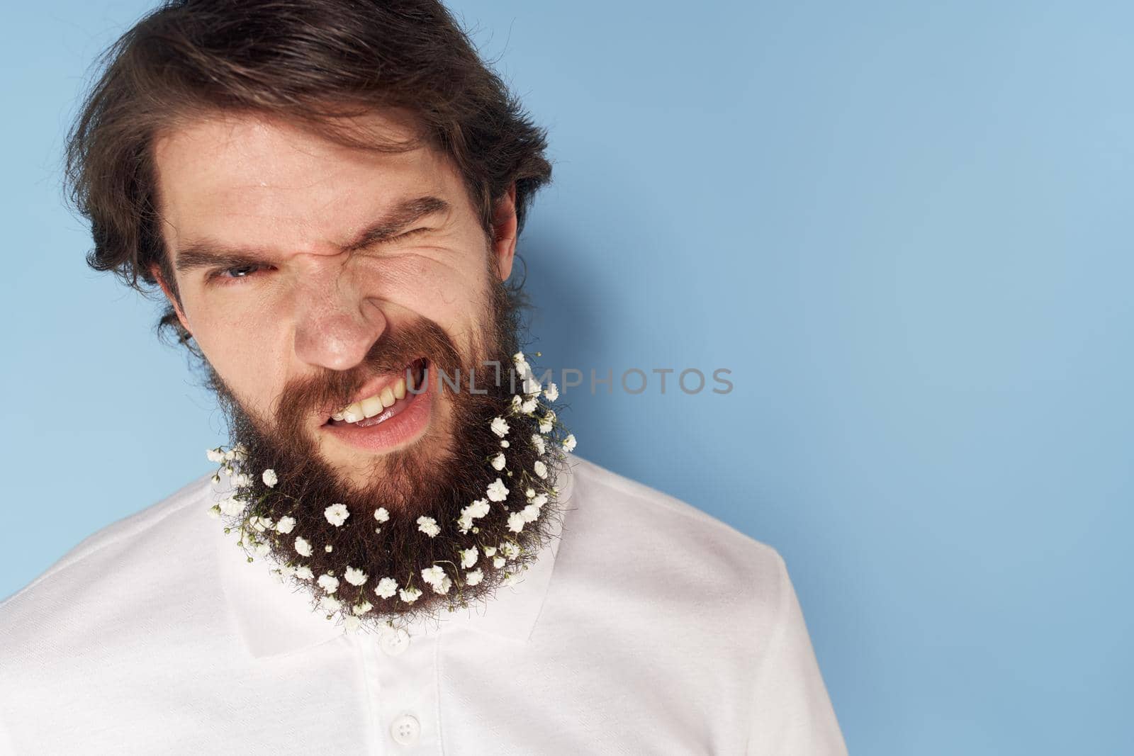 Cute man beard flowers decoration close-up isolated background. High quality photo