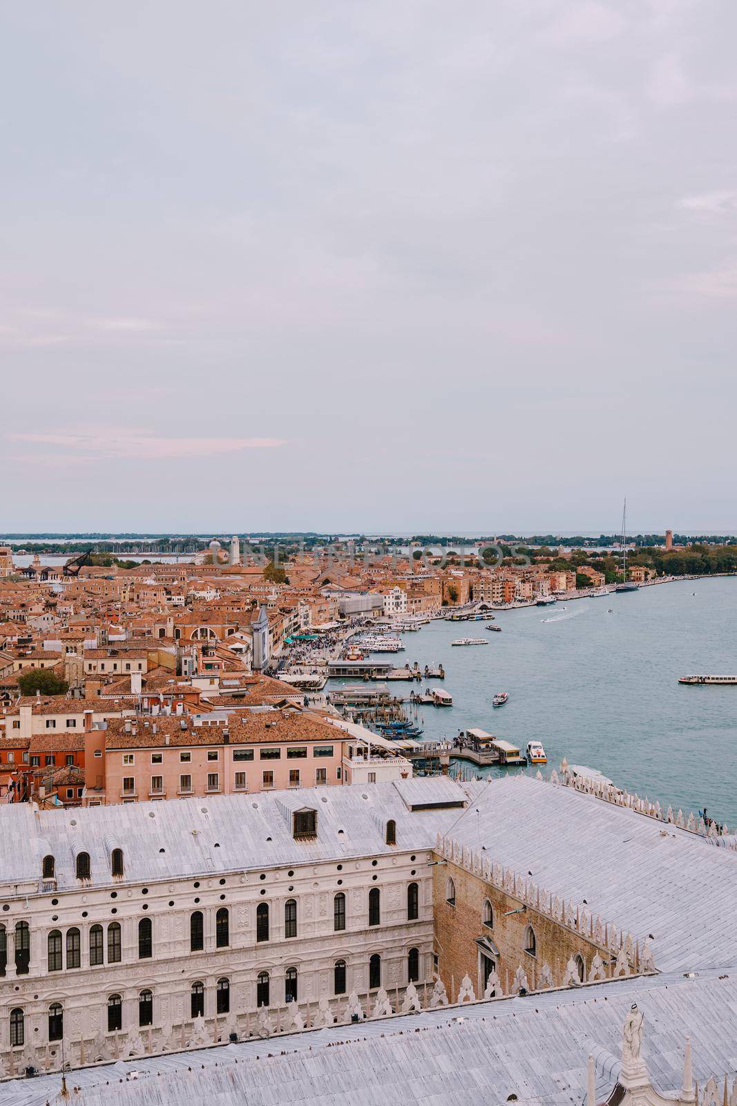 The ferry pier and mooring place for gondolas - San Marco-San Zaccaria, Venice, Italy. Aerial view from huge cathedral bell tower Saint Mark Campanile.