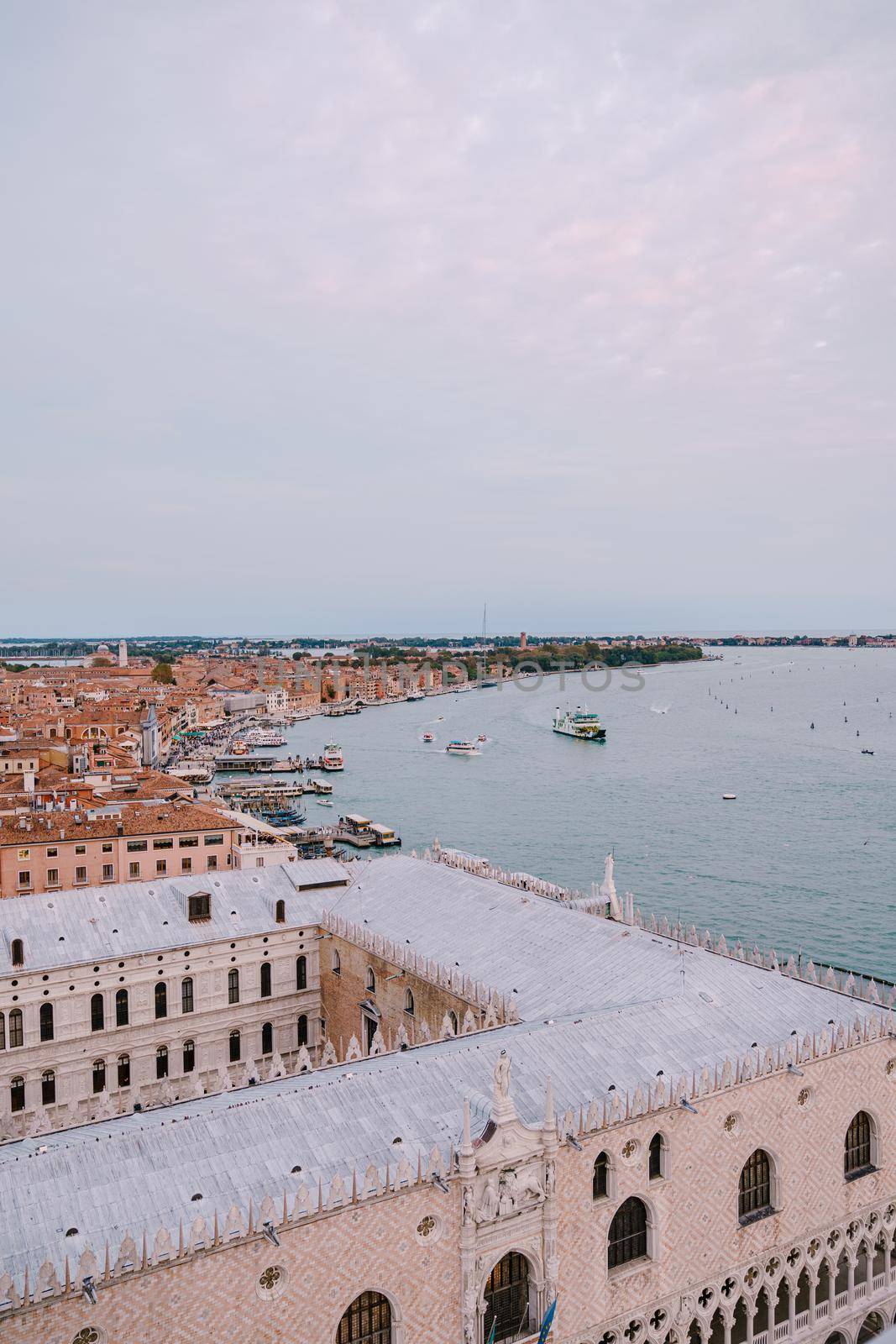 The ferry pier and mooring place for gondolas - San Marco-San Zaccaria, Venice, Italy. Aerial view from huge cathedral bell tower Saint Mark Campanile.