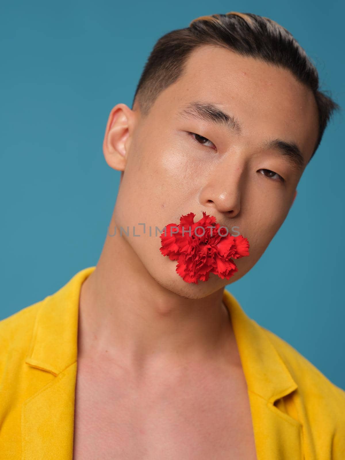 Portrait of a Korean man with a red flower in his mouth and a yellow jacket by SHOTPRIME
