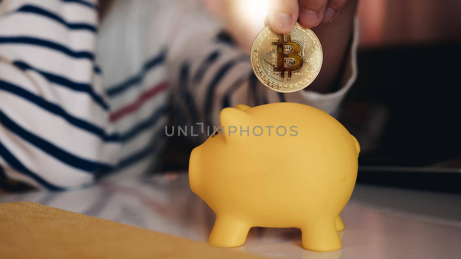 Business woman put bitcoin to piggy bank, bit coin BTC the new virtual electronic money, investment concept