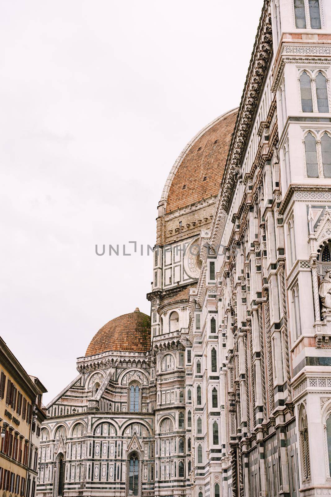 A close-up of the facade of the Santa Maria del Fiore building in Florence, Italy.