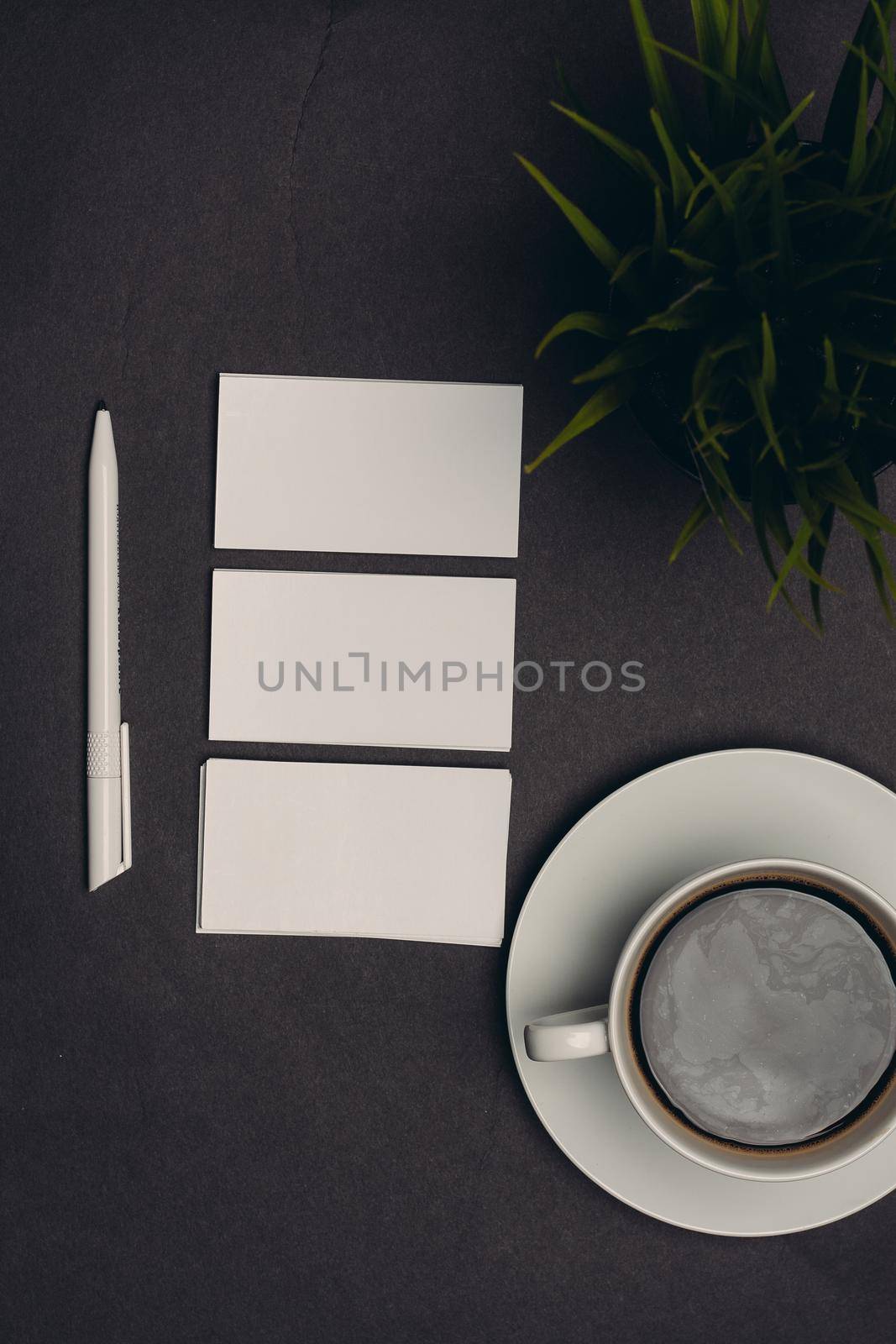 business cards on table and coffee cup pen top view. High quality photo